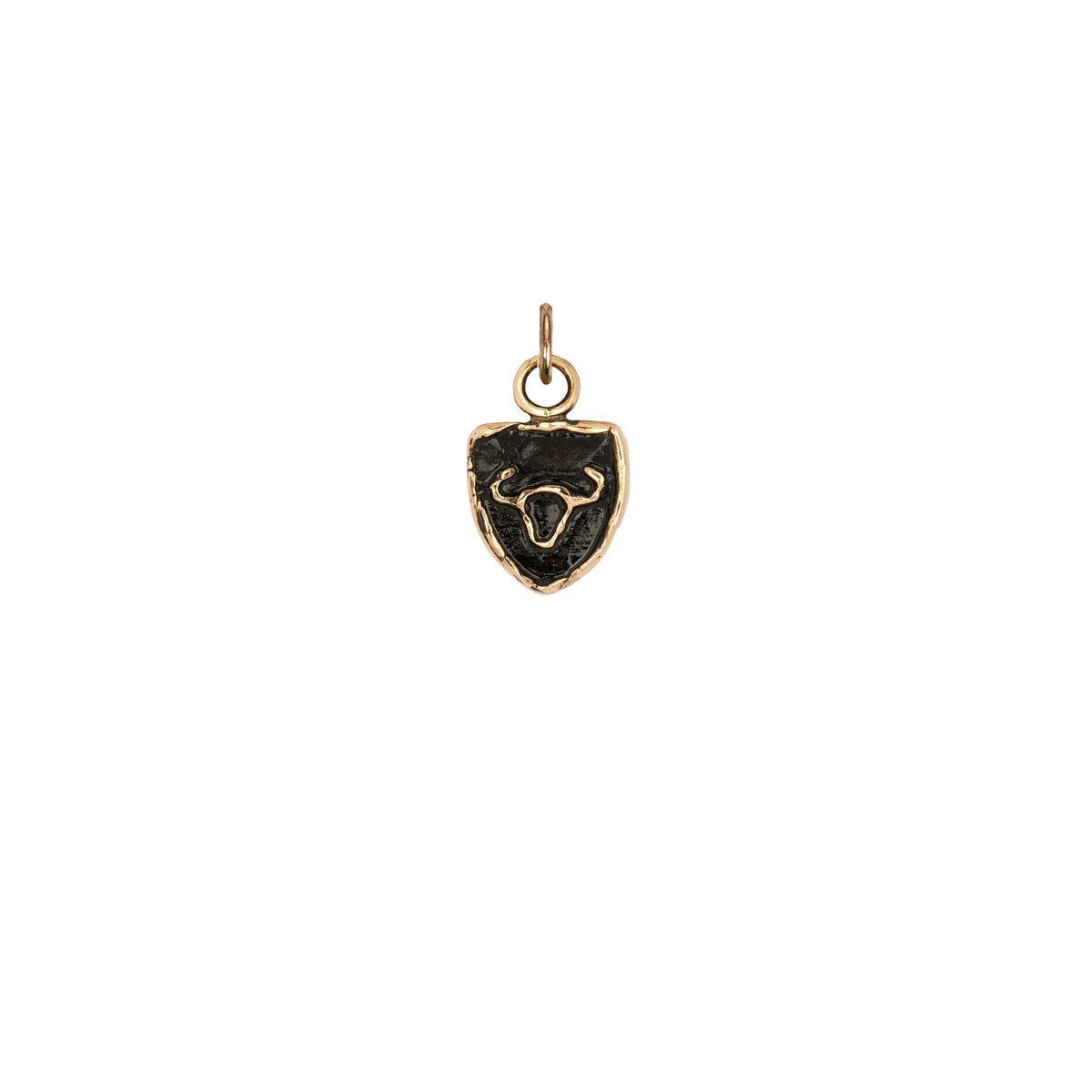 A 14k gold Taurus zodiac charm.