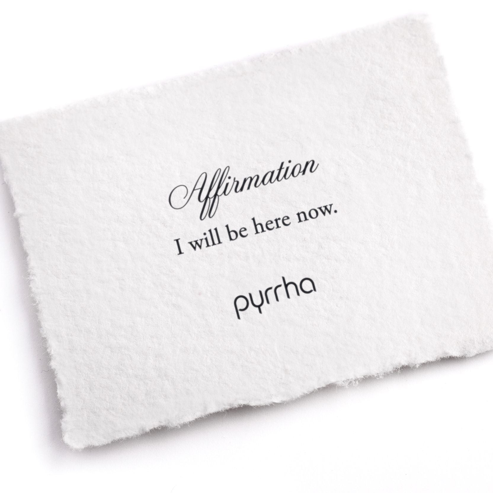 A hand-torn, letterpress printed card describing the meaning for Pyrrha's I will be here now Affirmation Talisman