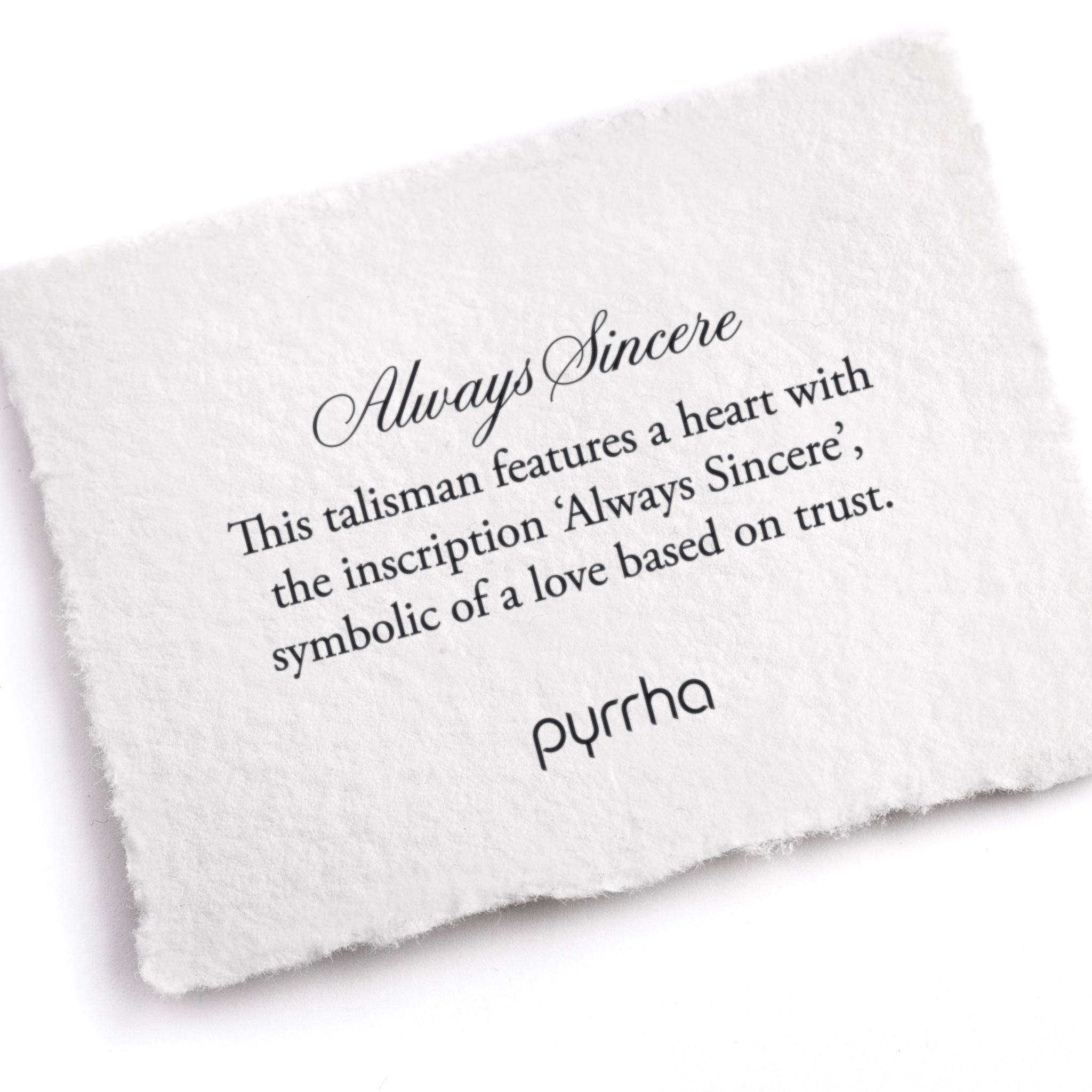A hand-torn, letterpress printed card describing the meaning for Pyrrha's Always Sincere Talisman