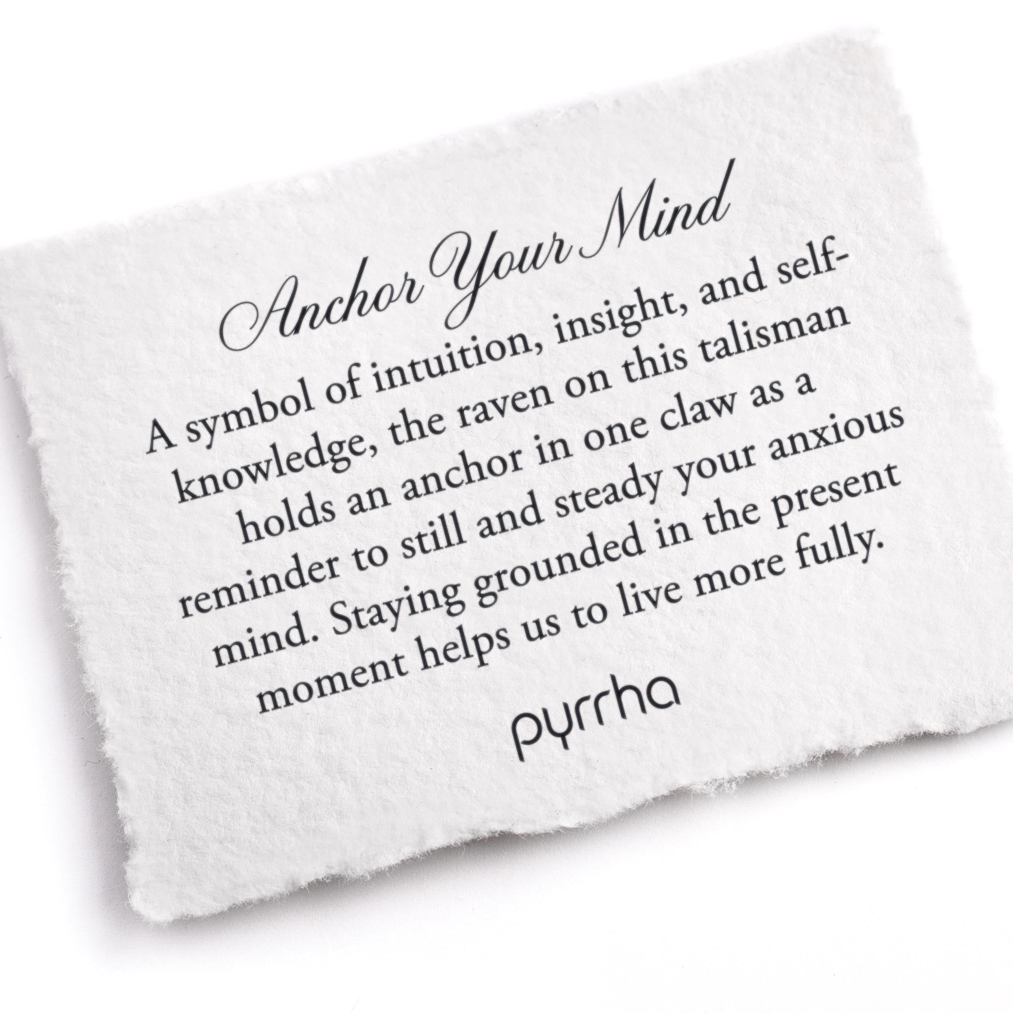 A hand-torn, letterpress printed card describing the meaning for Pyrrha's Anchor Your Mind Talisman