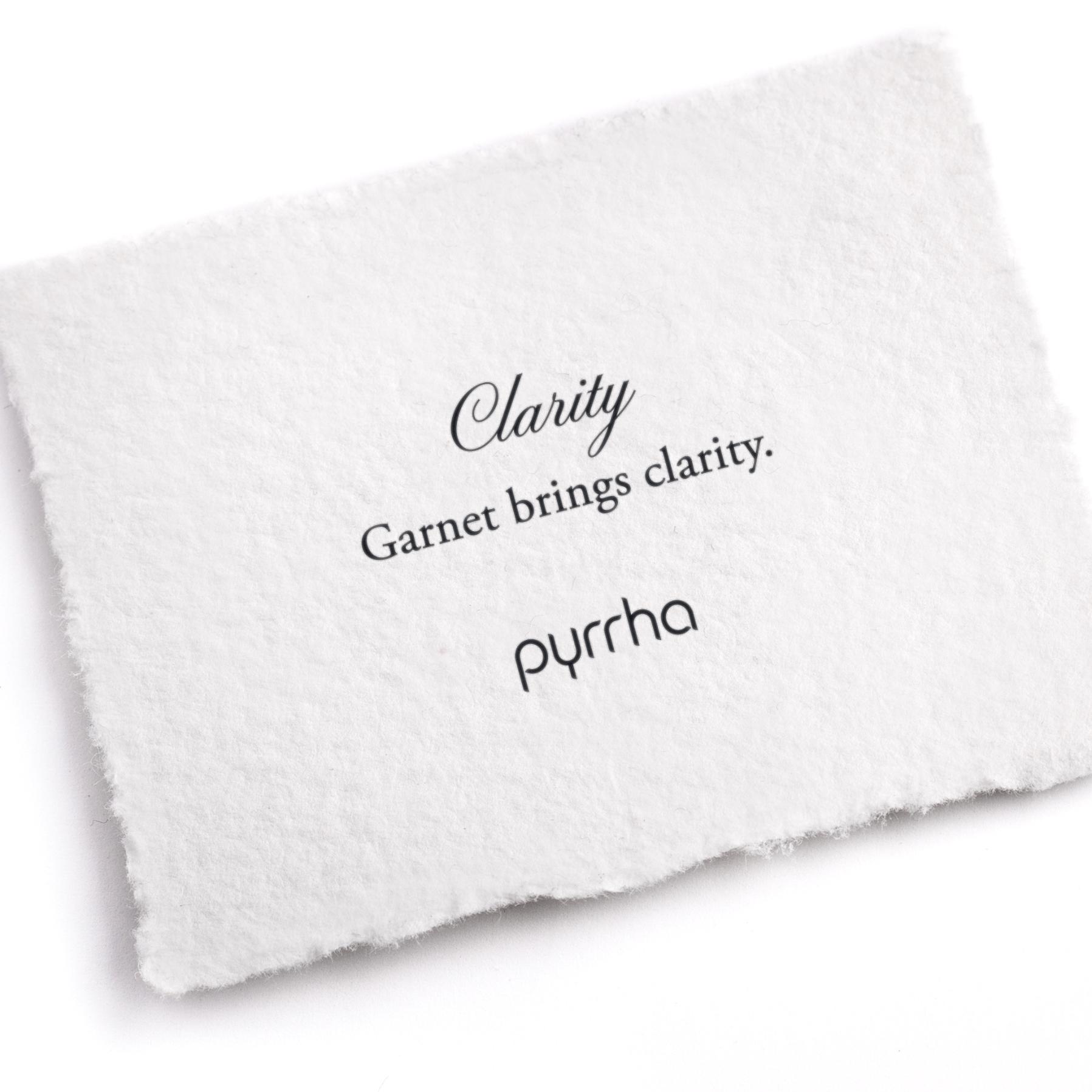 A hand-torn, letterpress printed card describing the meaning for Pyrrha's Clarity Attraction Charm