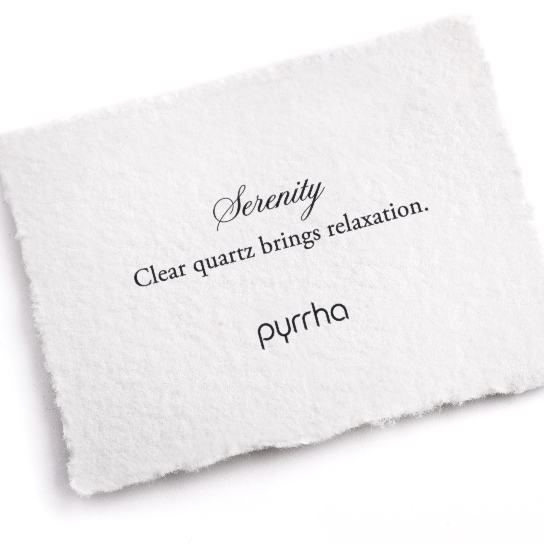 A hand-torn, letterpress printed card describing the meaning for Pyrrha's Serenity Attraction Charm