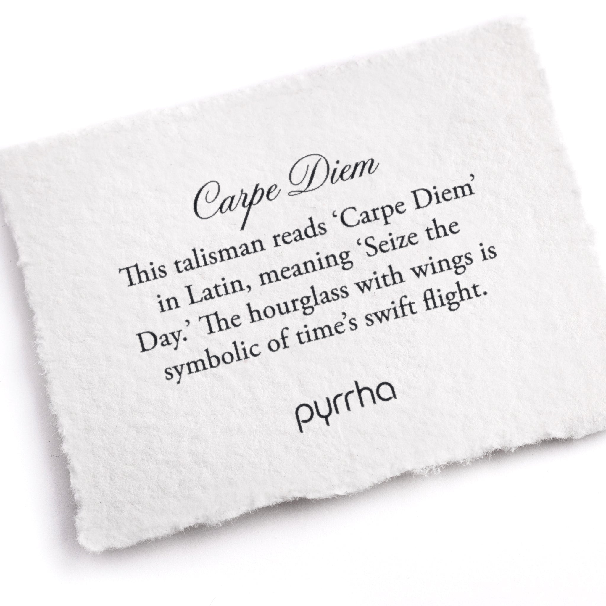 A hand-torn, letterpress printed card describing the meaning for Pyrrha's Carpe Diem Talisman