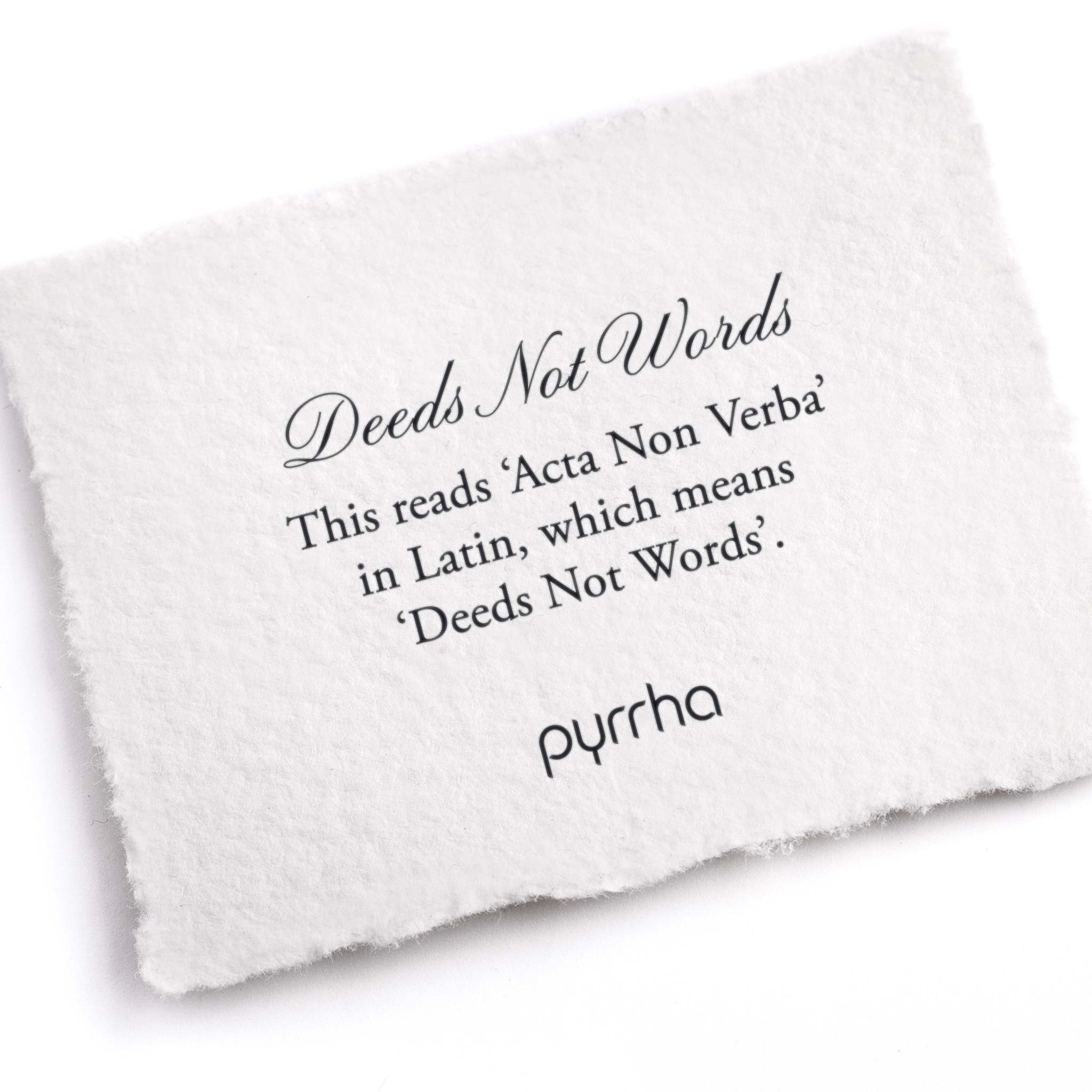 A hand-torn, letterpress printed card describing the meaning for Pyrrha's Deeds Not Words Latin Motto Band Ring
