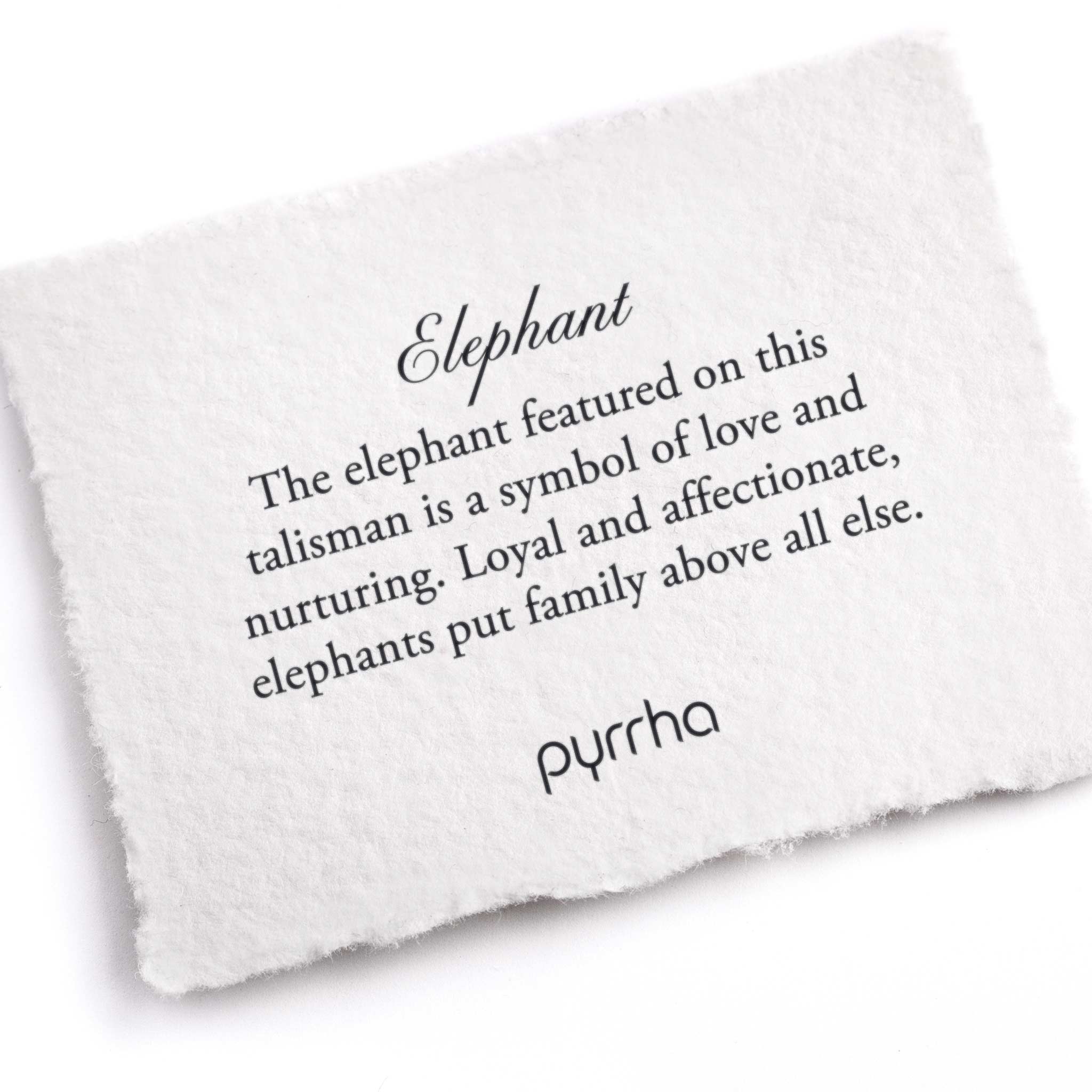 A hand-torn, letterpress printed card describing the meaning for Pyrrha's Elephant Talisman