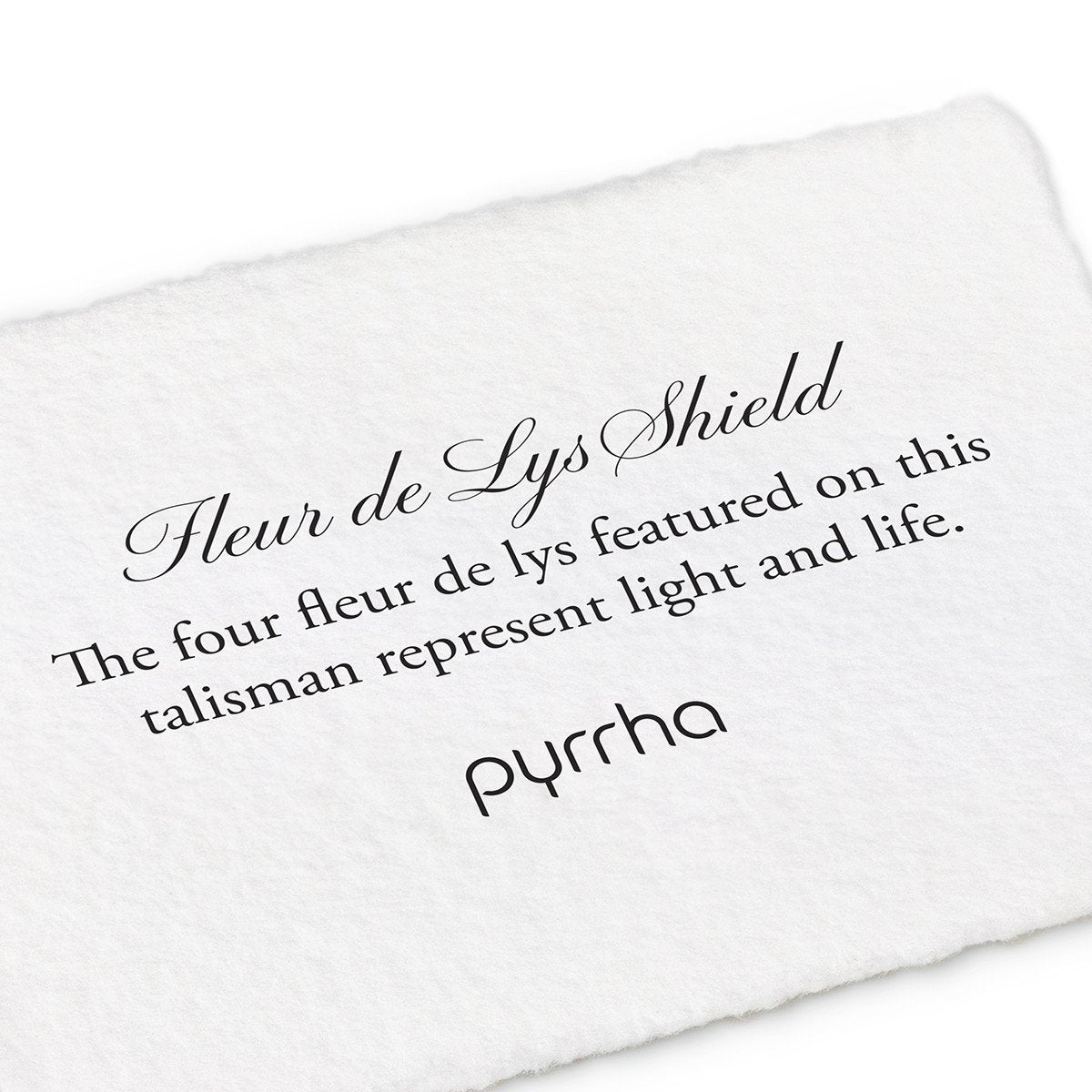 A hand-torn, letterpress printed card describing the meaning for Pyrrha's Fleur de Lys Shield