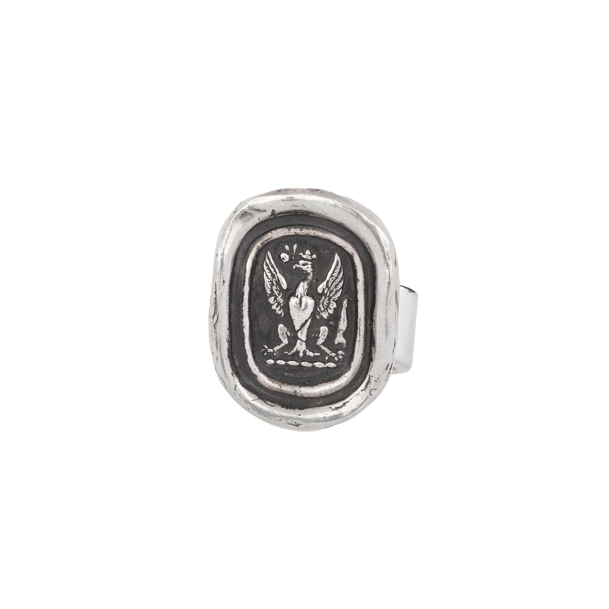 A silver textured band ring with our Follow Your Dreams talisman on it.