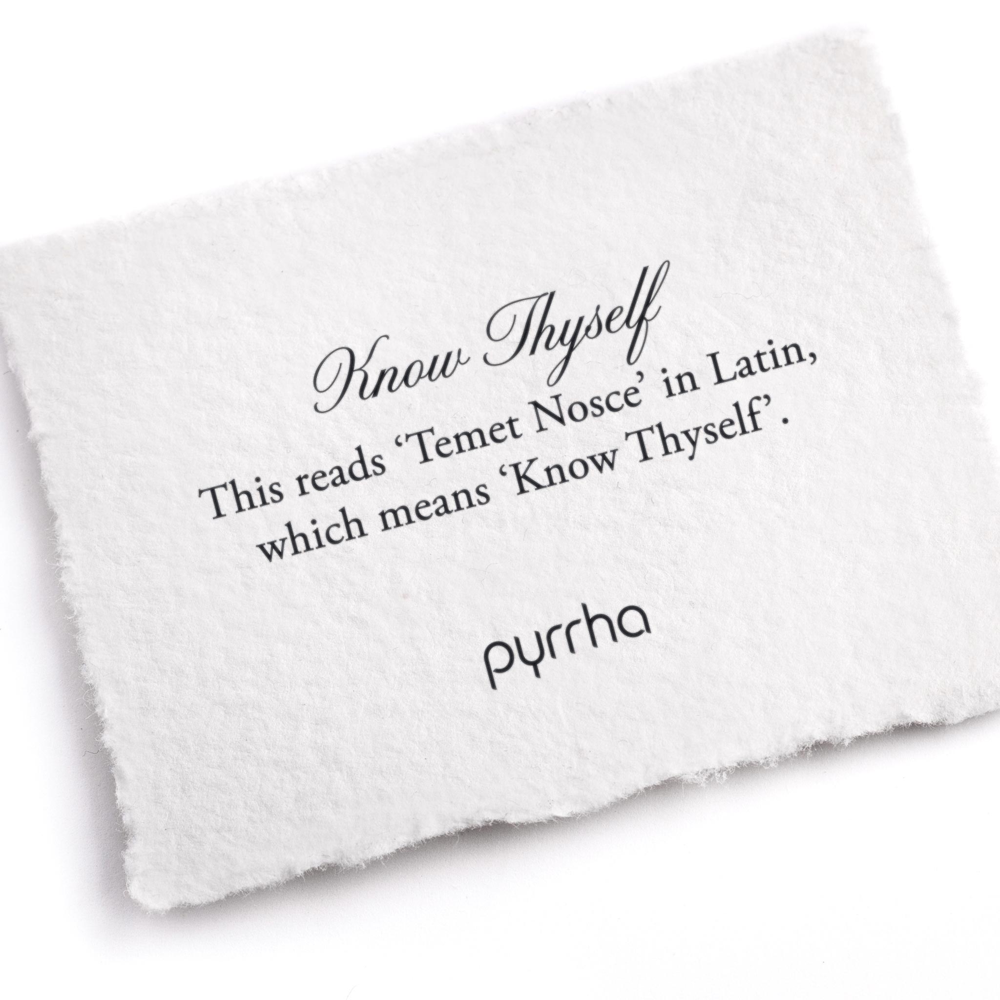 A hand-torn, letterpress printed card describing the meaning for Pyrrha's Know Thyself Ring