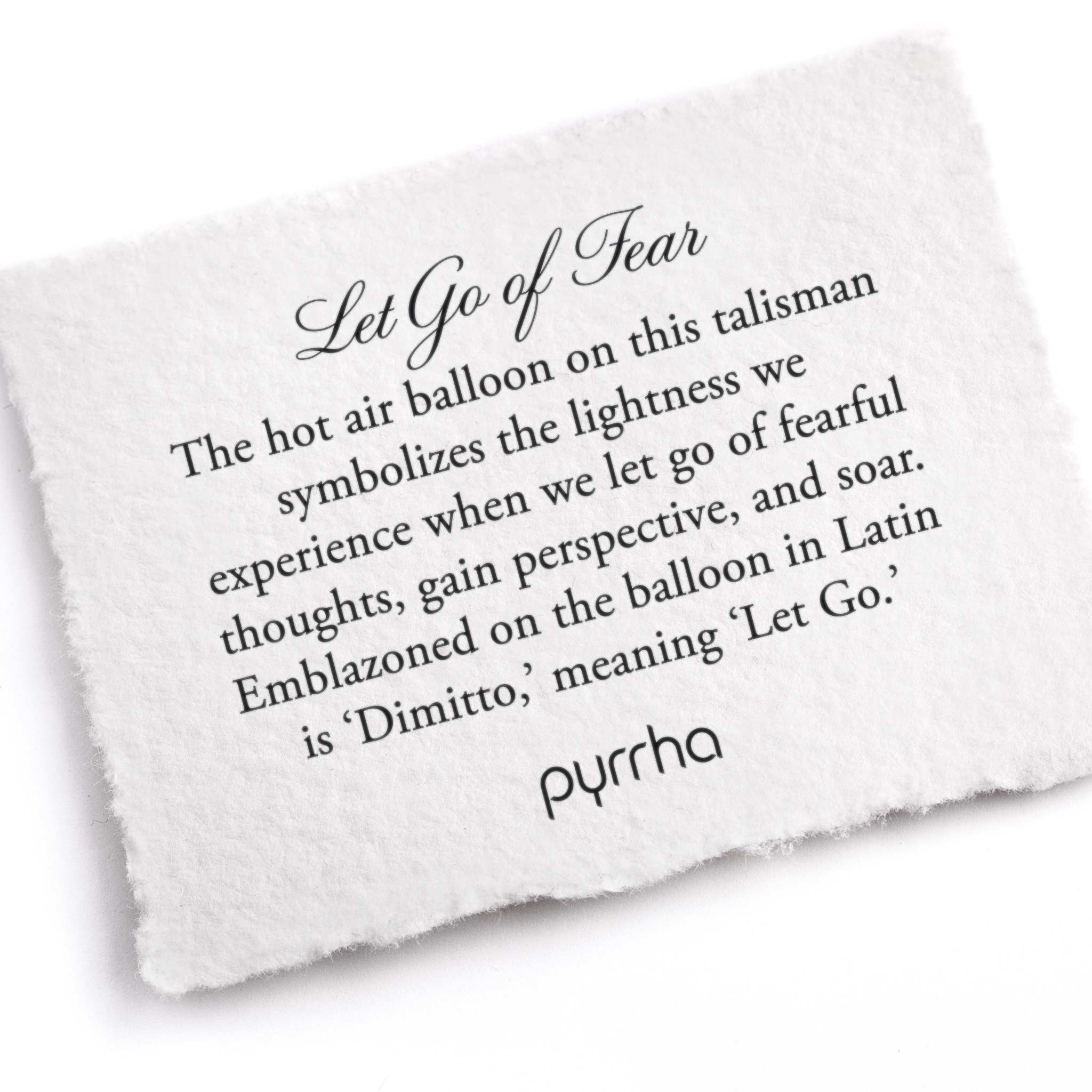 A hand-torn, letterpress printed card describing the meaning for Pyrrha's Let Go of Fear Talisman