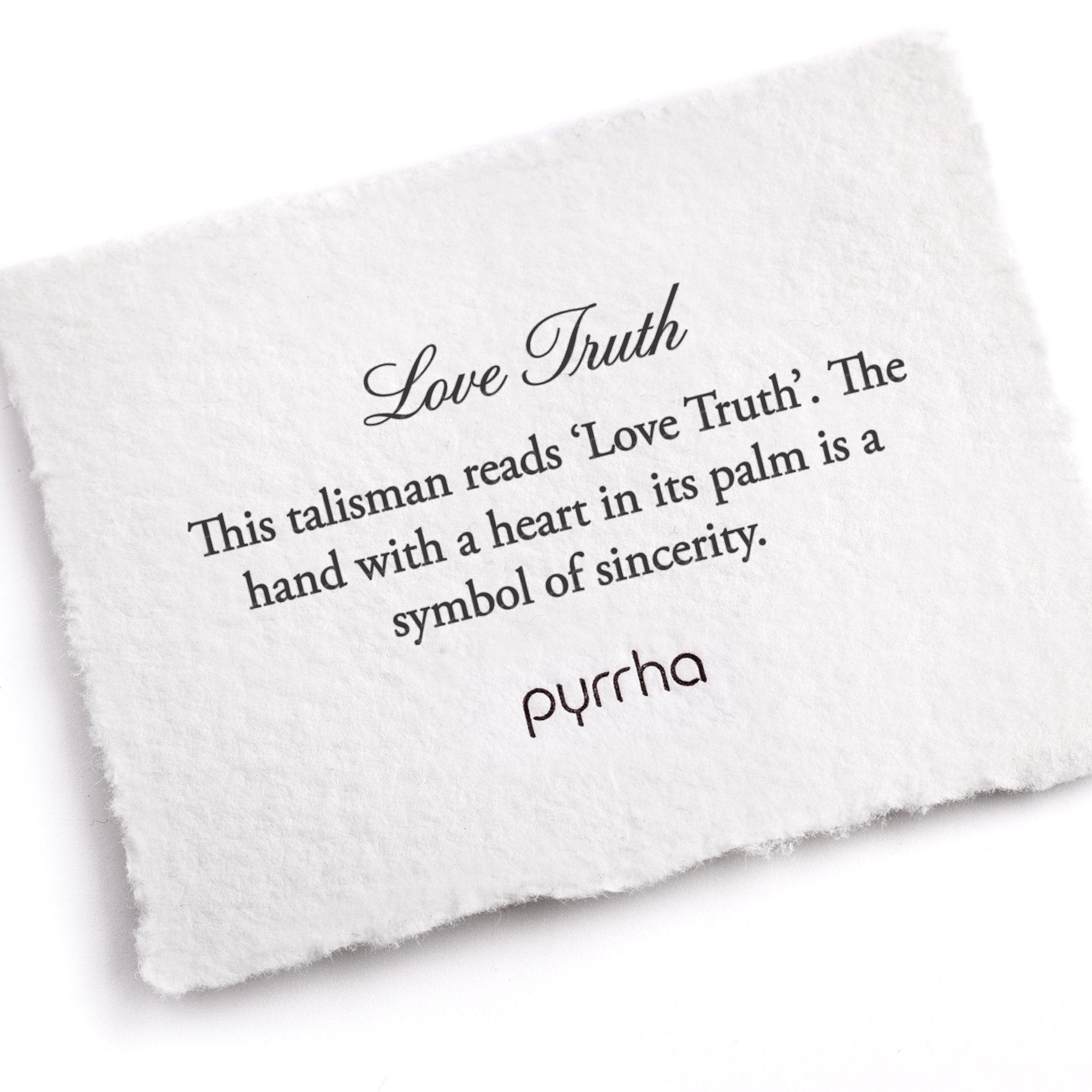 A hand-torn, letterpress printed card describing the meaning for Pyrrha's Love Truth Talisman