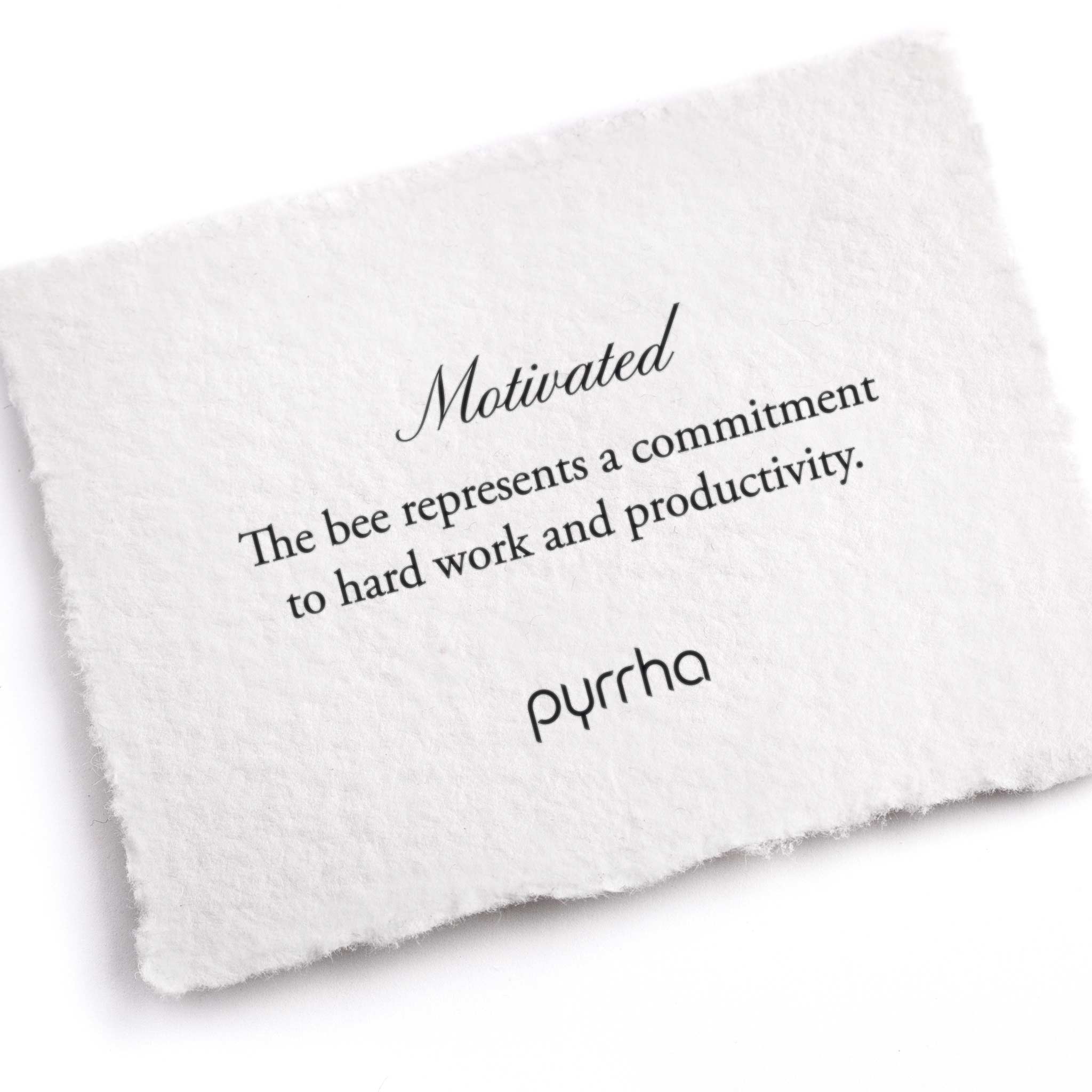 A hand-torn, letterpress printed card describing the meaning for Pyrrha's Motivated Appreciation Talisman
