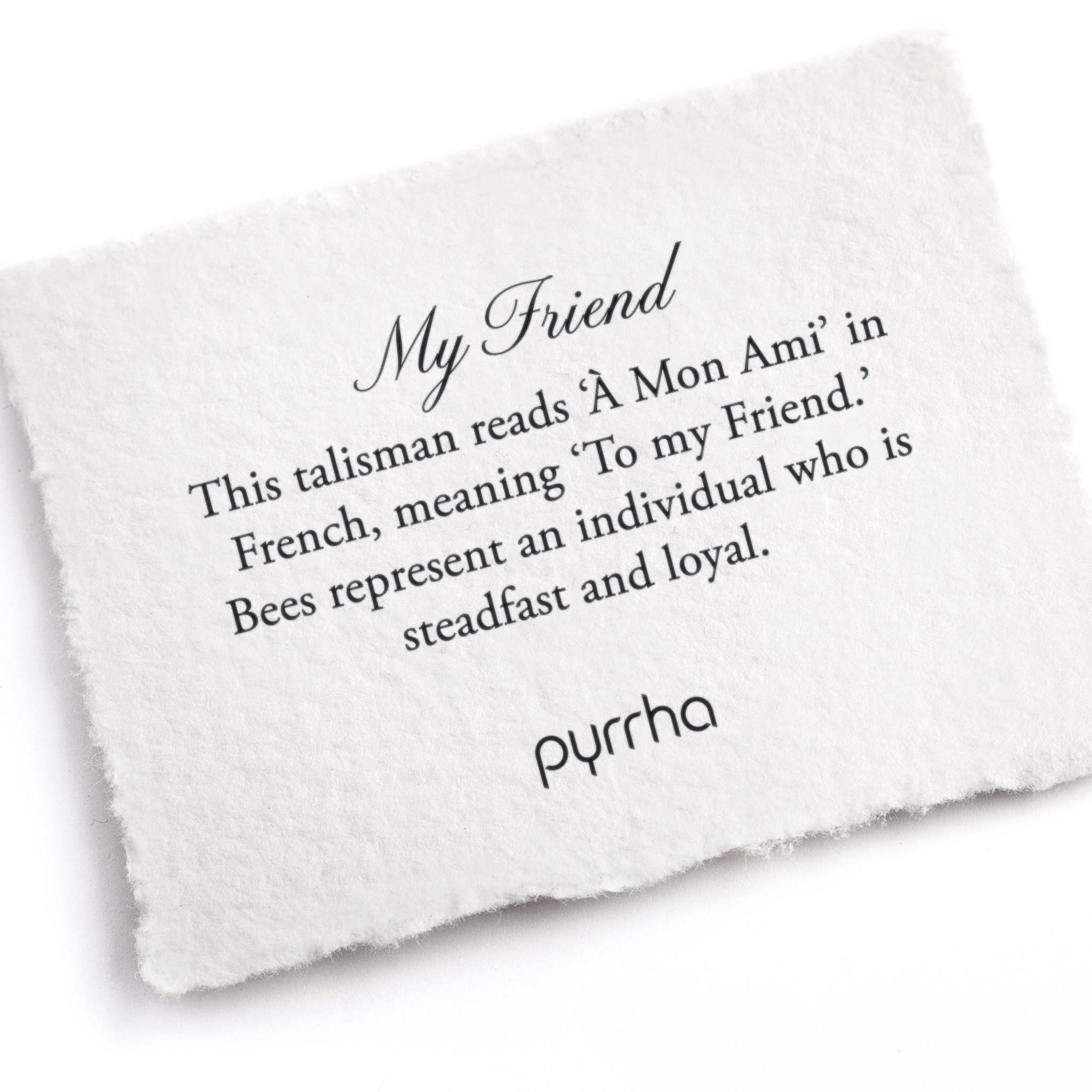 A hand-torn, letterpress printed card describing the meaning for Pyrrha's My Friend Talisman