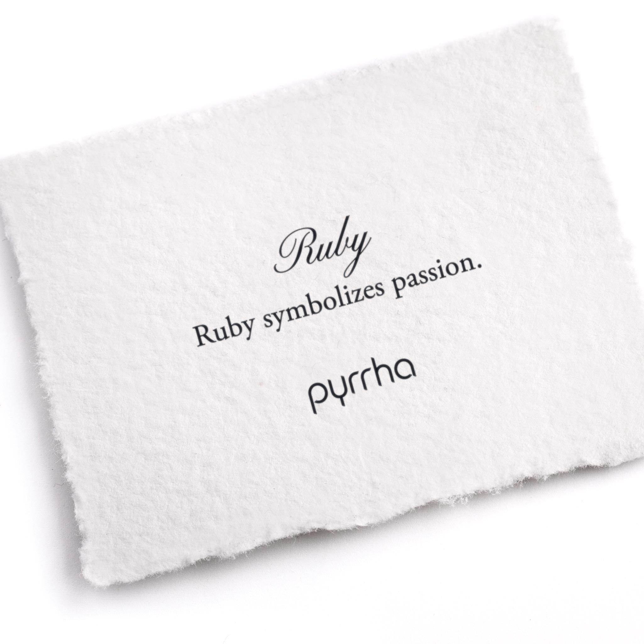A hand-torn, letterpress printed card describing the meaning for Pyrrha's Ruby stone