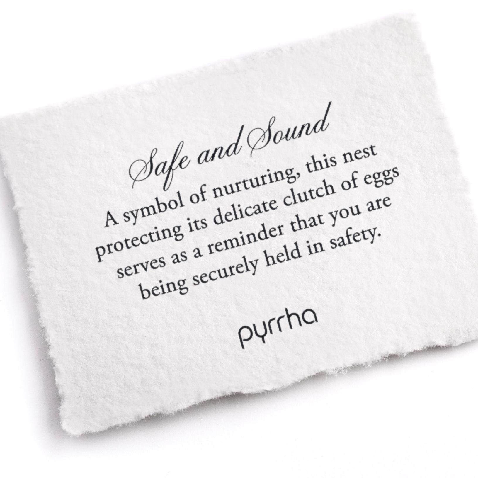 A hand-torn, letterpress printed card describing the meaning for Pyrrha's Safe and Sound Talisman