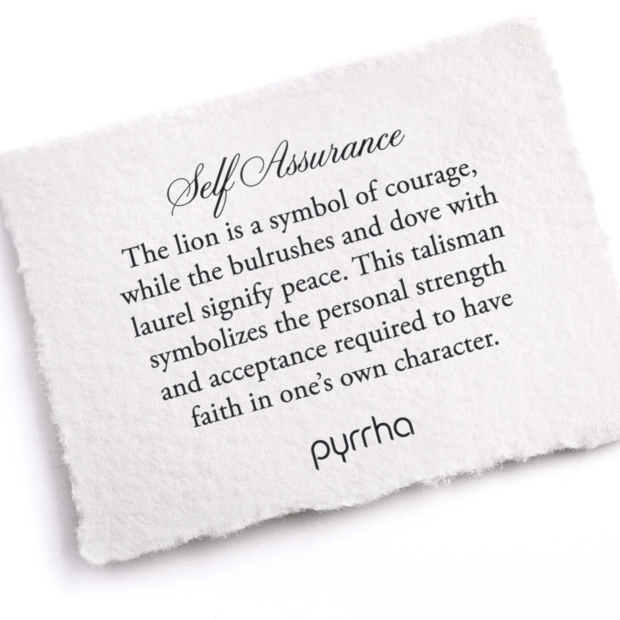 A hand-torn cotton card describing the meaning for Pyrrha's Self Assurance Talisman