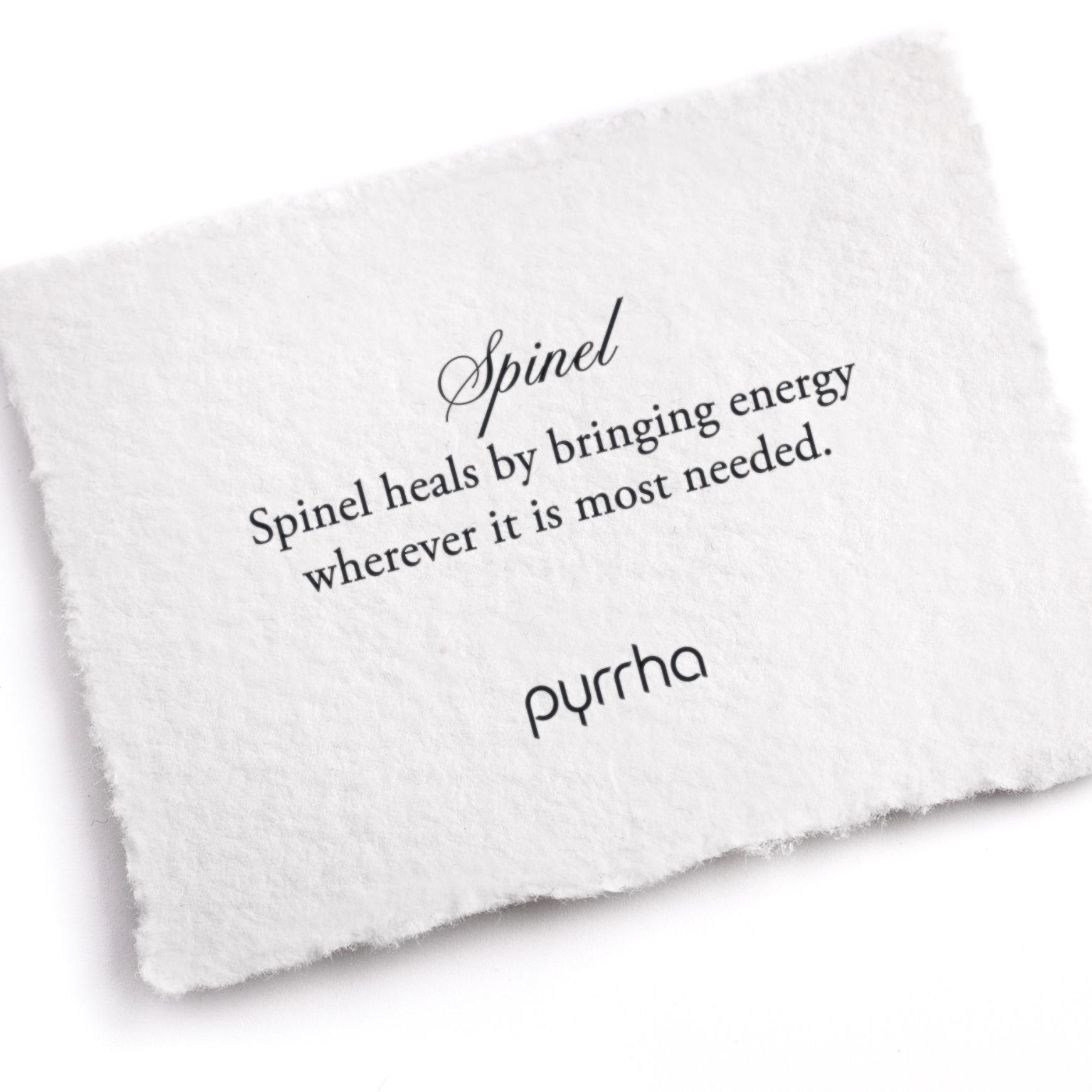 A hand-torn, letterpress printed card describing the meaning for Pyrrha's Spinel stone