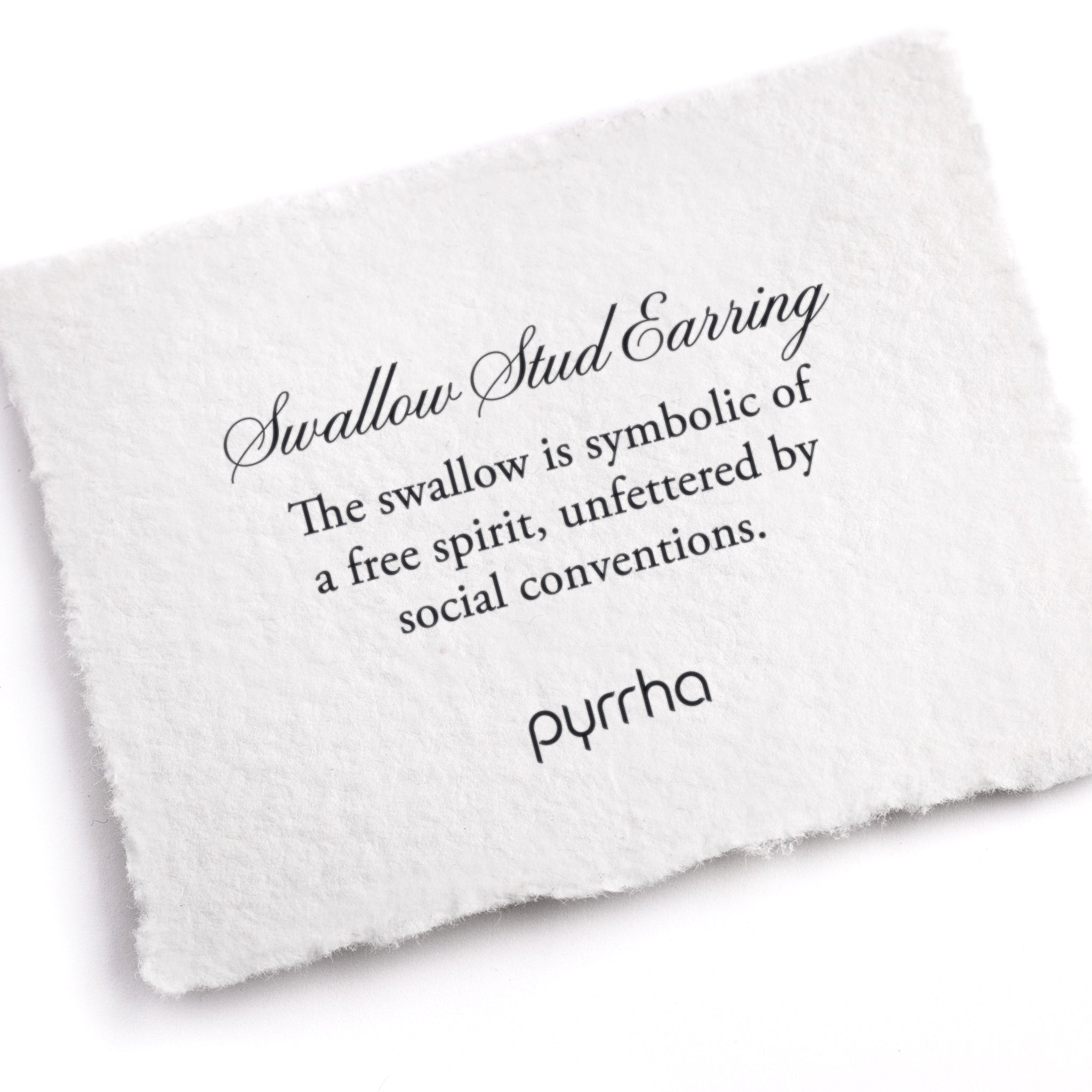 A hand-torn, letterpress printed card describing the meaning for Pyrrha's Swallow Charm