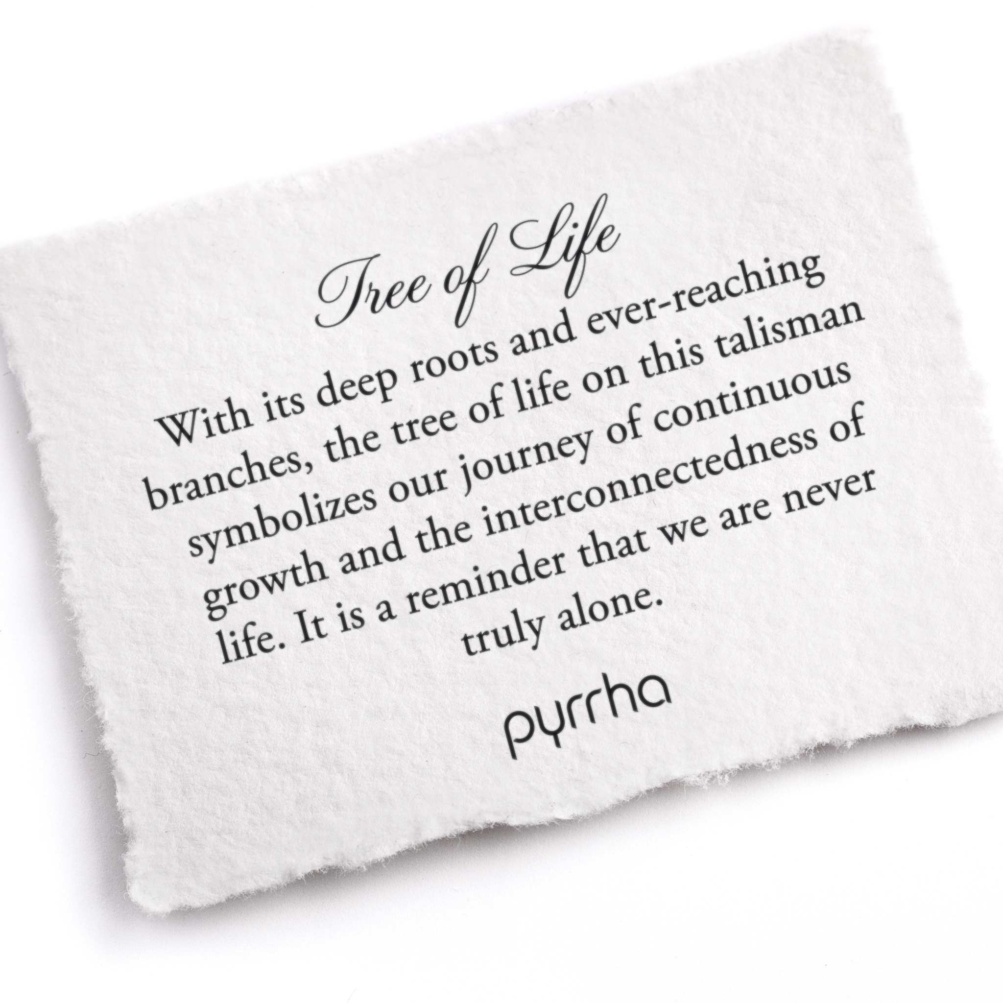 A hand-torn, letterpress printed card describing the meaning for Pyrrha's Tree of Life Talisman