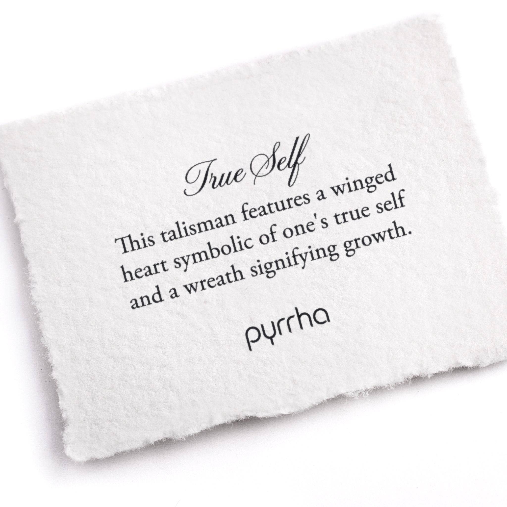 A hand-torn, letterpress printed card describing the meaning for Pyrrha's True Self Talisman