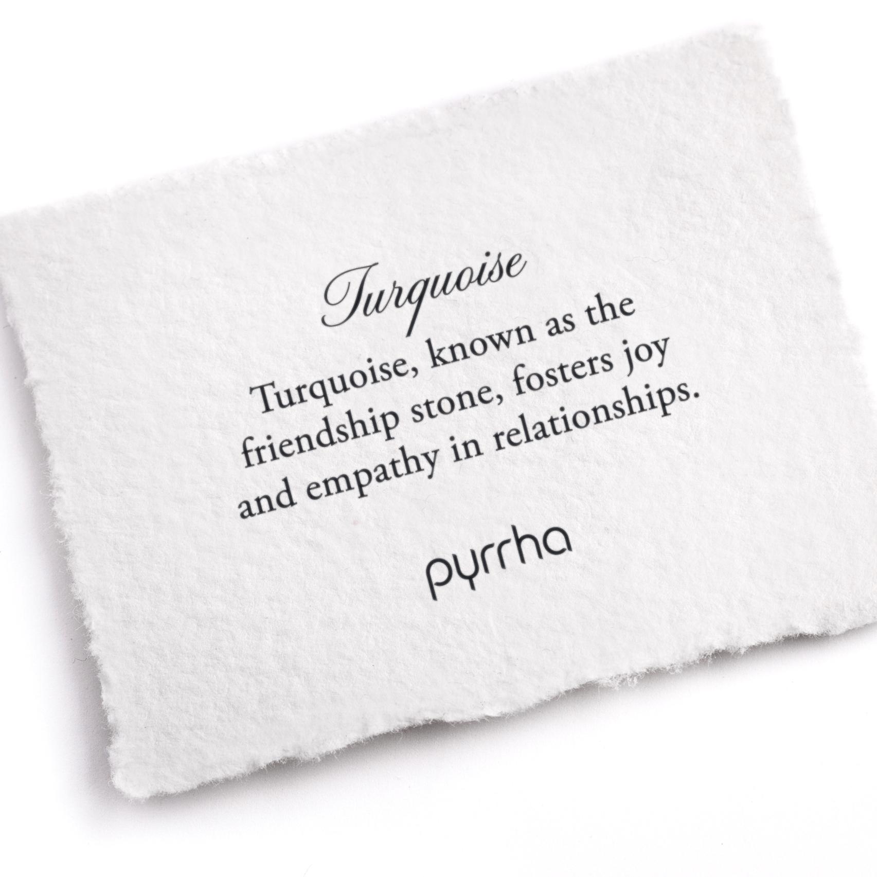A hand-torn, letterpress printed card describing the meaning for Pyrrha's Turquoise stone