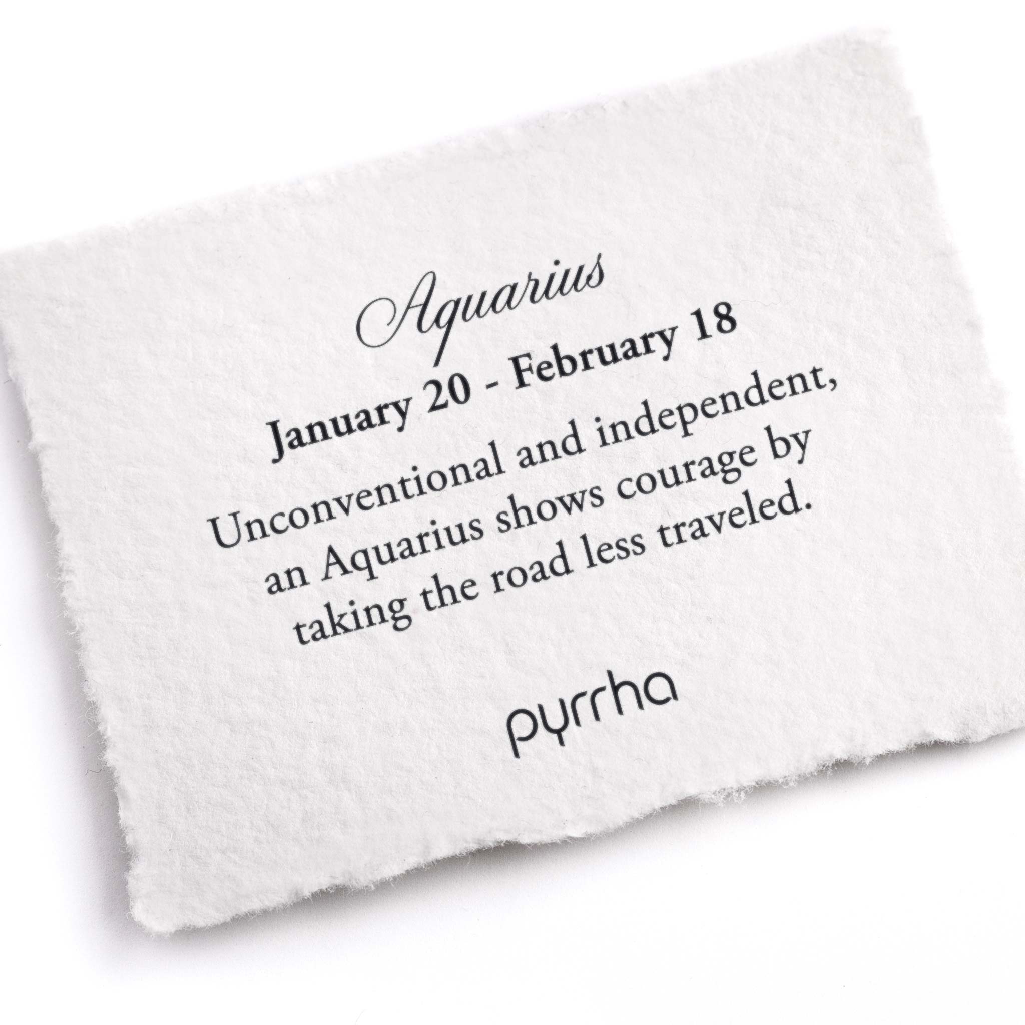 A hand-torn, letterpress printed card describing the meaning for Pyrrha's Aquarius Zodiac Talisman