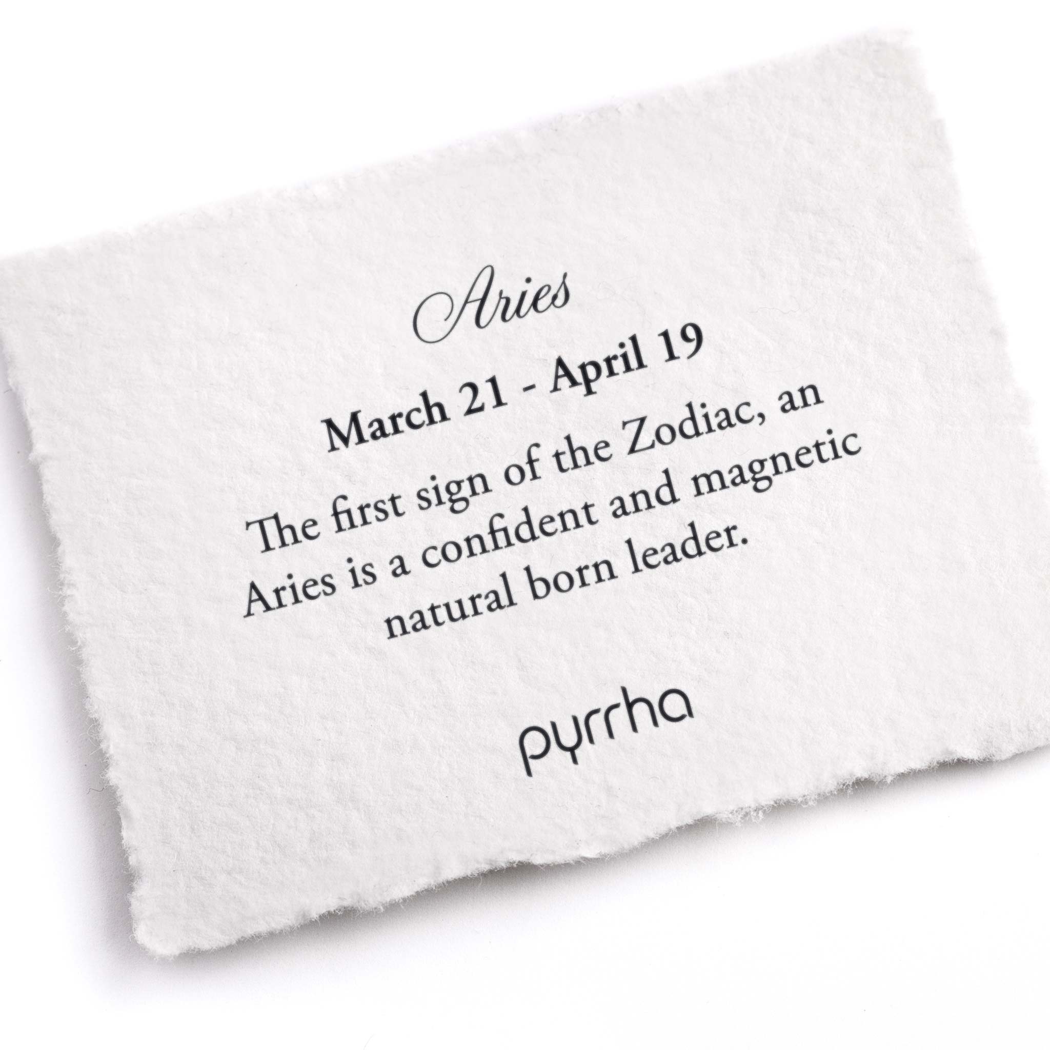 A hand-torn, letterpress printed card describing the meaning for Pyrrha's Aries Zodiac Talisman
