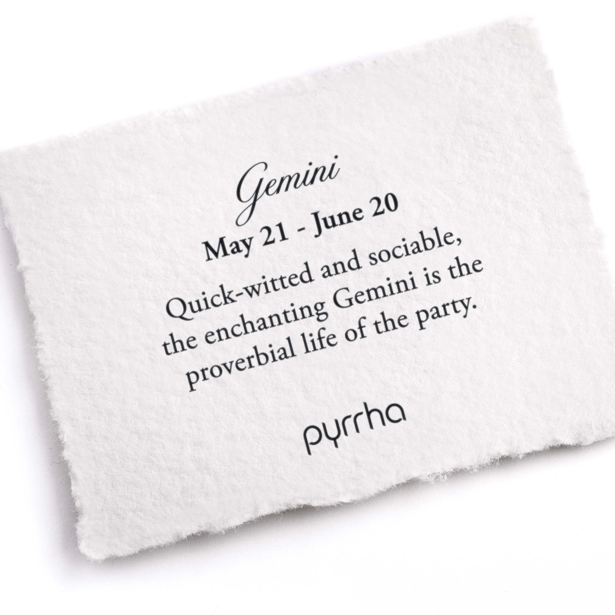 A hand-torn, letterpress printed card describing the meaning for Pyrrha's Gemini Zodiac Talisman