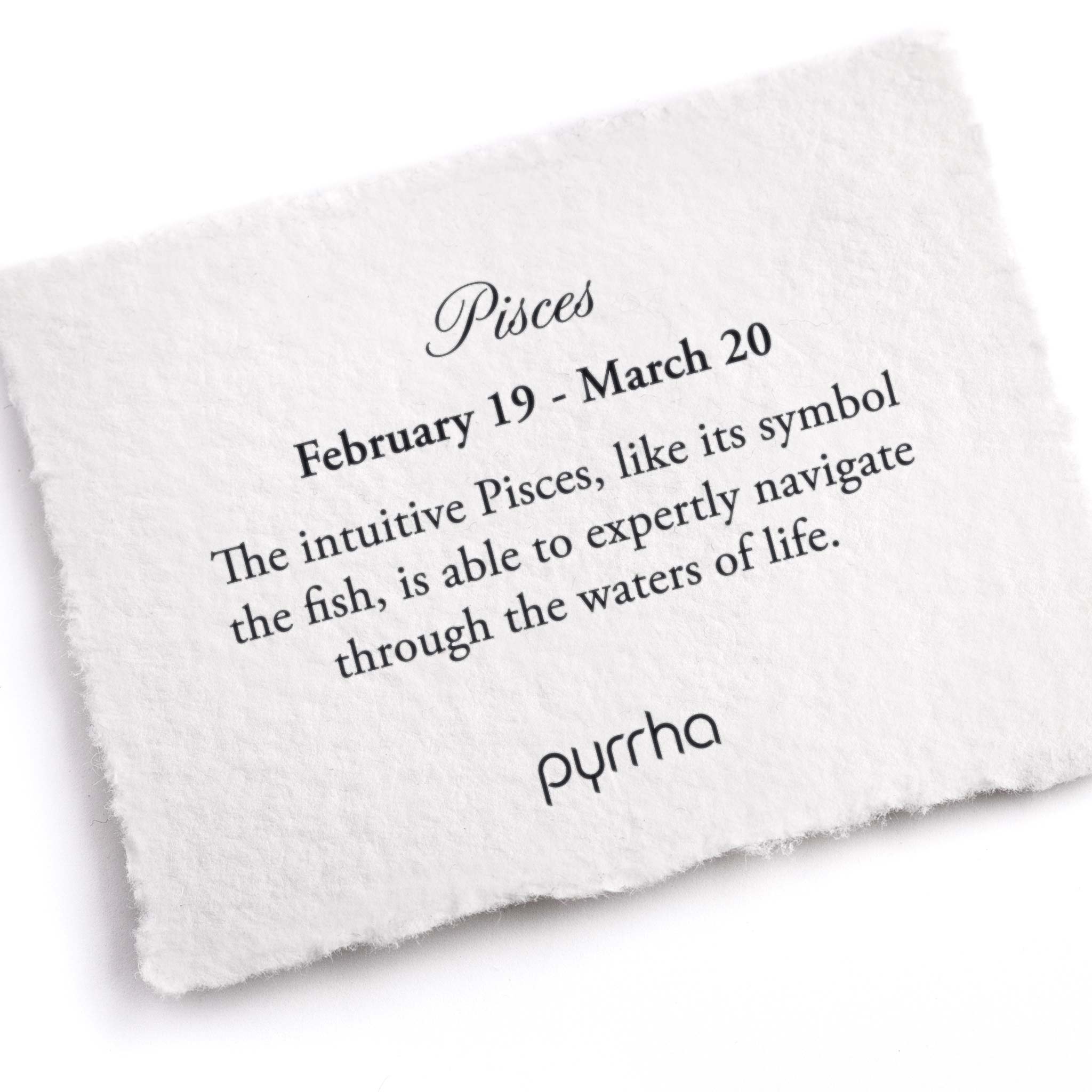 A hand-torn, letterpress printed card describing the meaning for Pyrrha's Pisces Zodiac Talisman