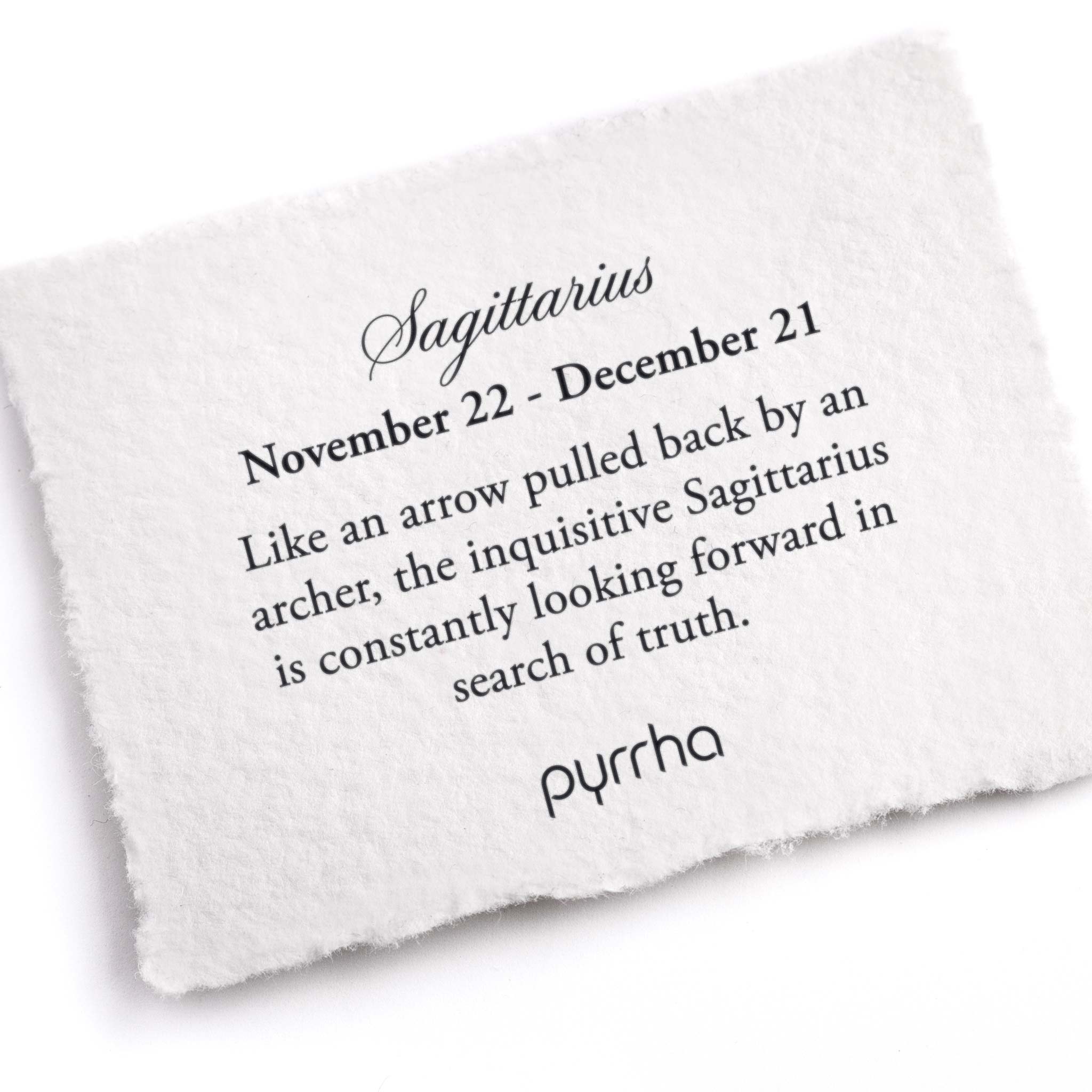 A hand-torn, letterpress printed card describing the meaning for Pyrrha's Sagittarius Zodiac Talisman